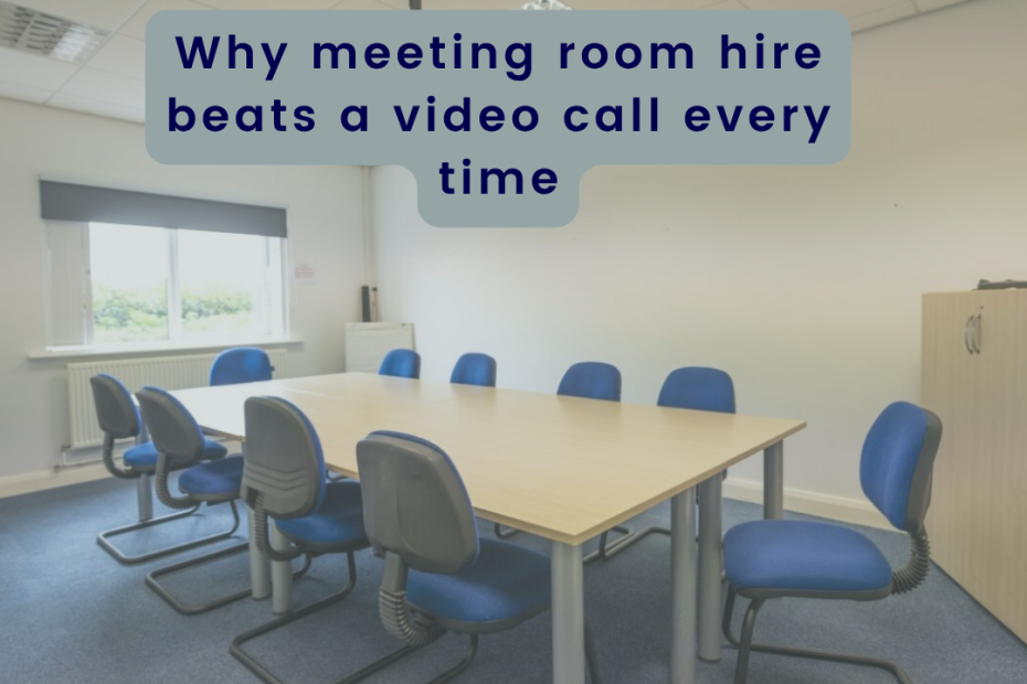 a meeting room set up with a large central time and blue chairs around in a light room at obsifian offices showing meeting rooms for hire
