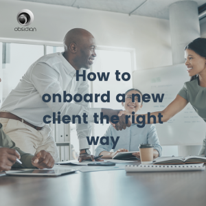 a lady and a man shaking hands around a table as they onboard a new client the right way
