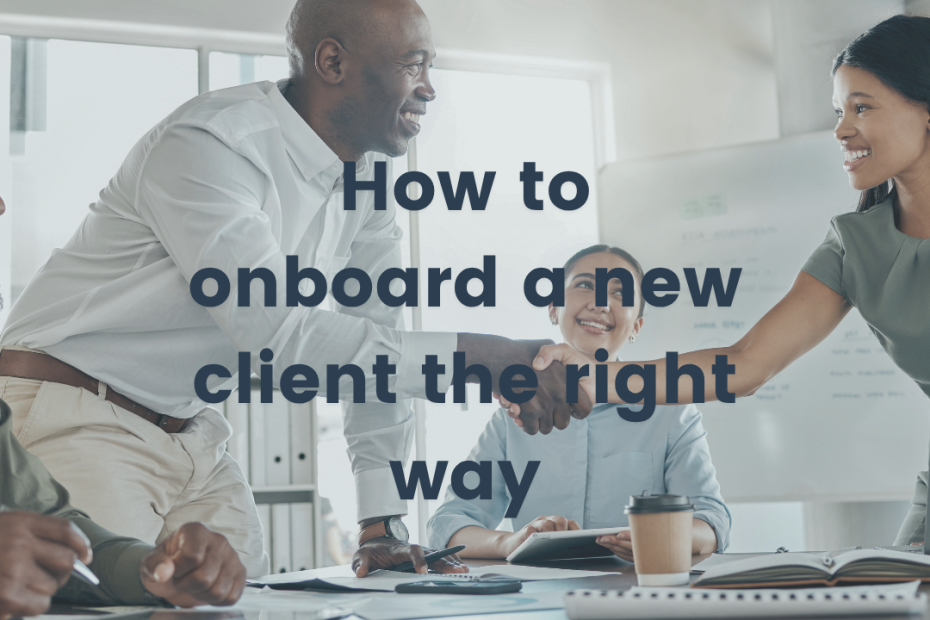 a lady and a man shaking hands around a table as they onboard a new client the right way