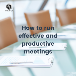 a glass table with tan leather chairs and papers and pens all lined up ready to run an effective and productive meeting